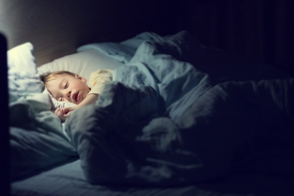 Image of a child sleeping in bed