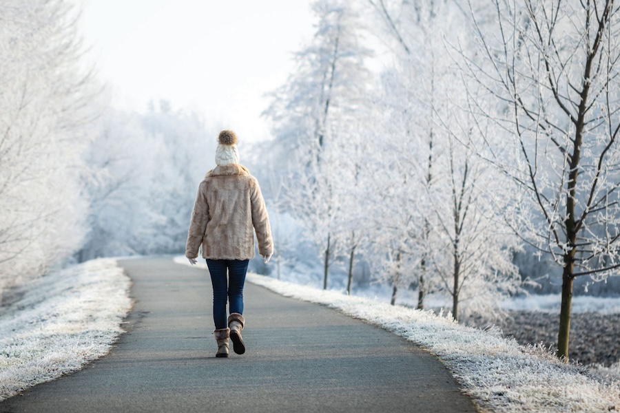 Image of a person walking on a snowy street