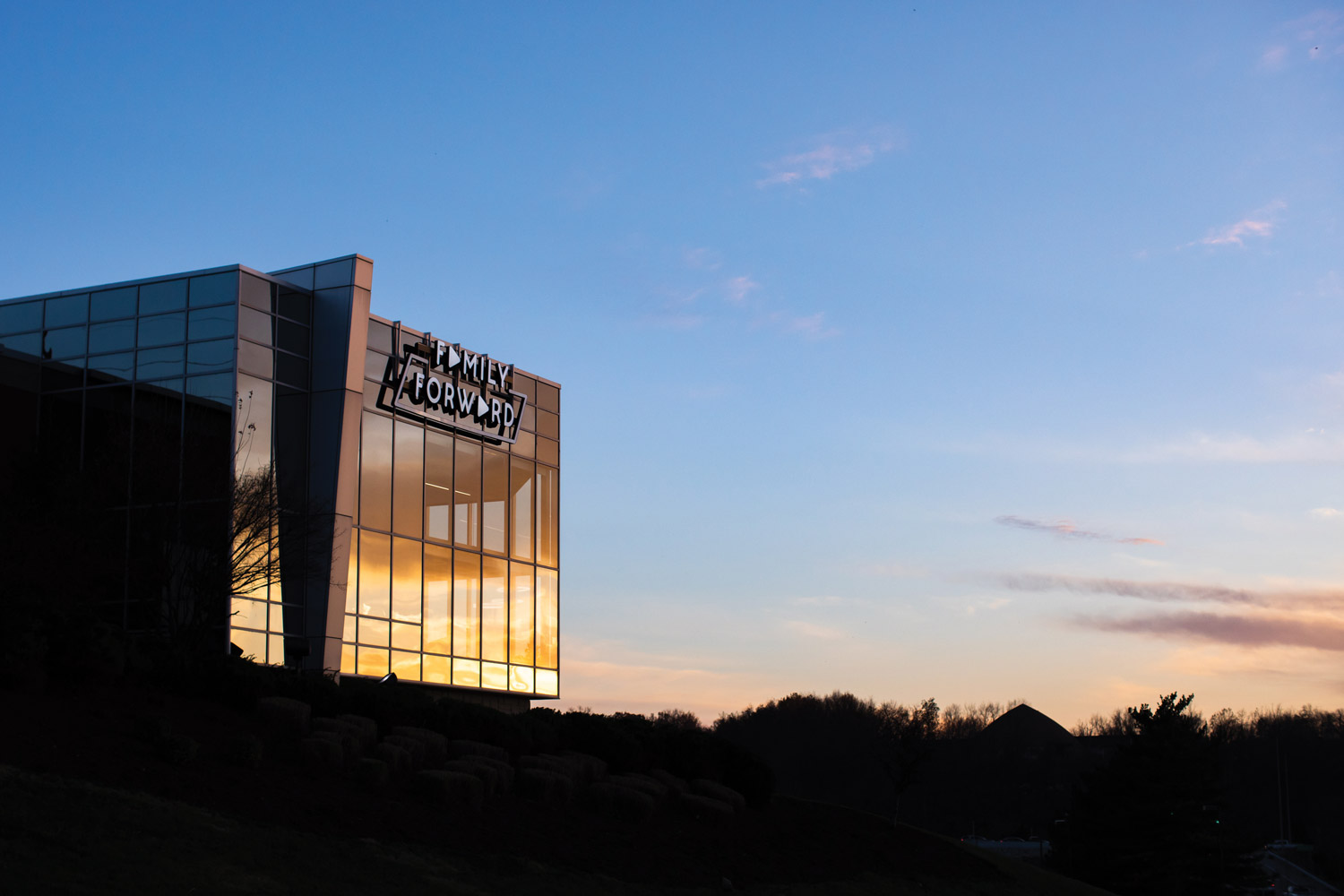 A drone shot of the exterior building of FamilyForward at sunset.