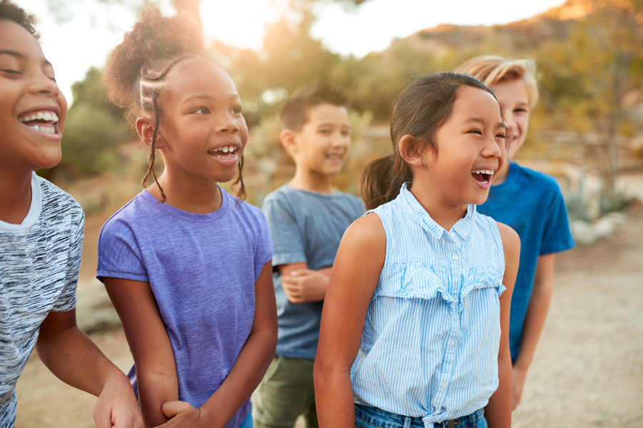 Group Of Multi-Cultural Children Posing And Hanging Out With Friends