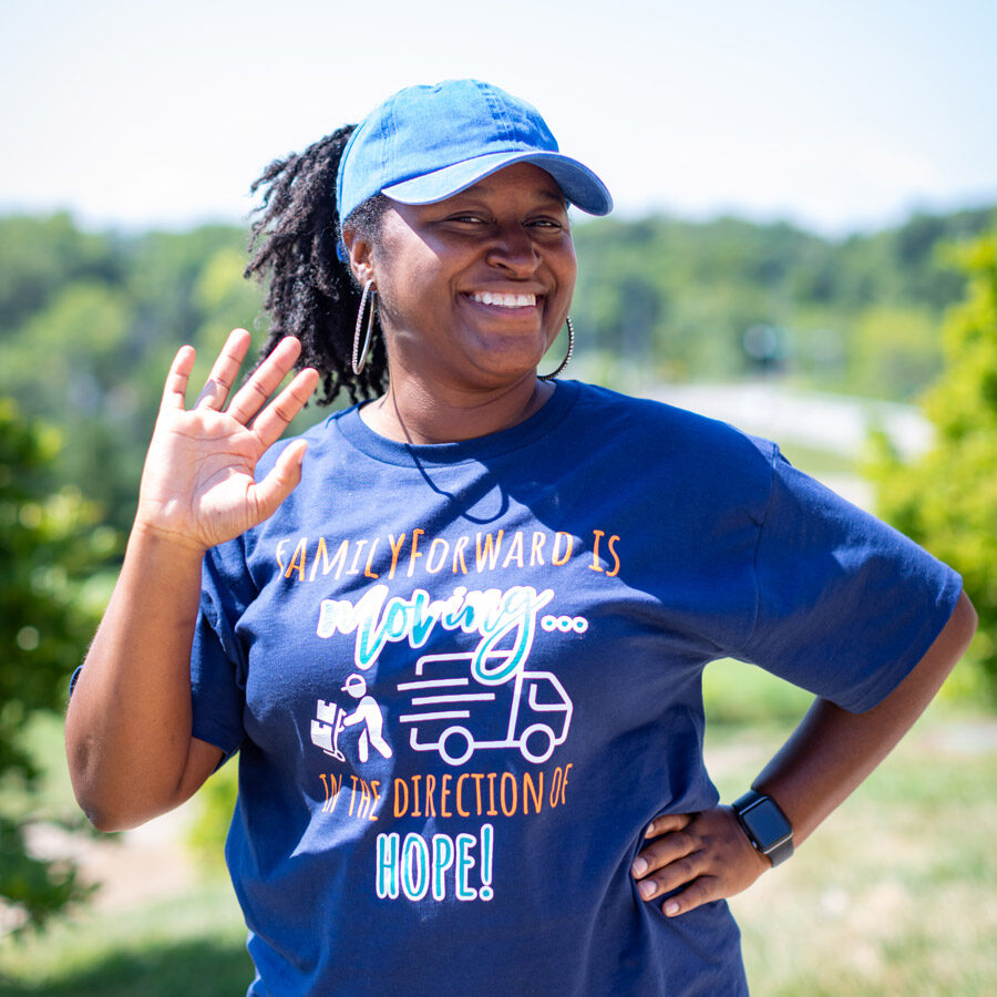 FamilyForward employee smiling and waving.