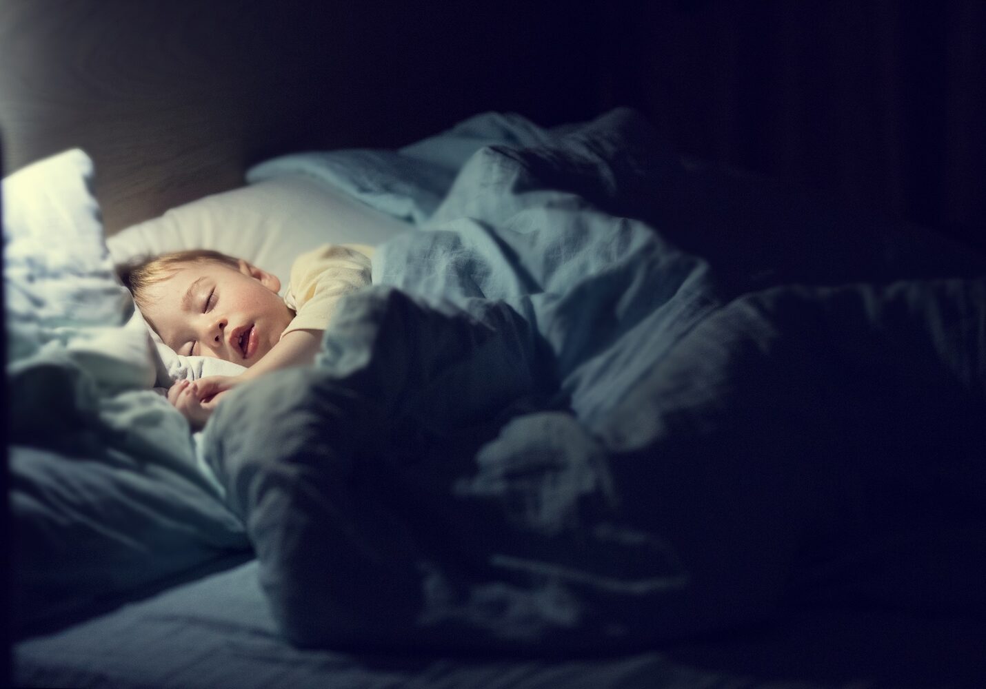 Image of a child sleeping in bed