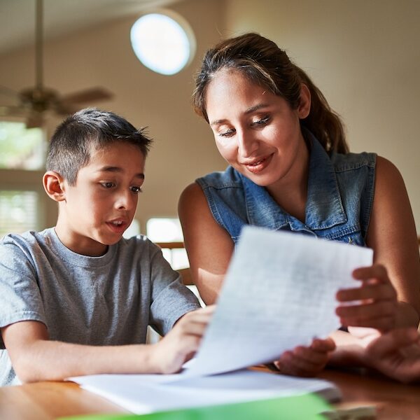 Image of mother helping son with homework