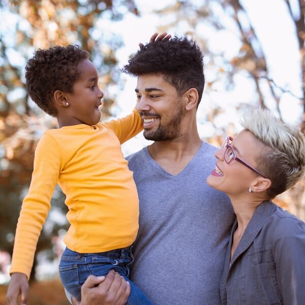 Image of a Happy young mixed race couple spending time with their daughter